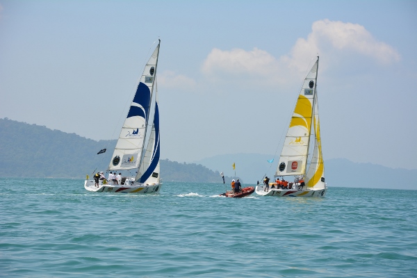 Koo (blue) and Masyuri try to ouwit each other on the waters of Langkawi today.
