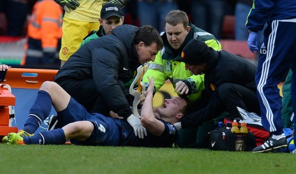 Manchester United's Phil Jones being treated after a clash of heads with Jonathan Walters/AFP pic.