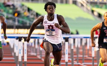 Tharp breaks world 110m hurdles record in Eugene